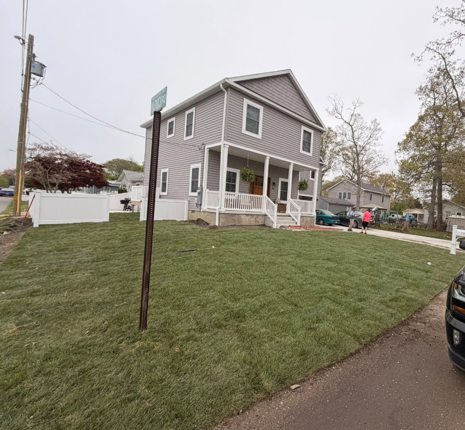 Full front yard sod installation for corner lot home